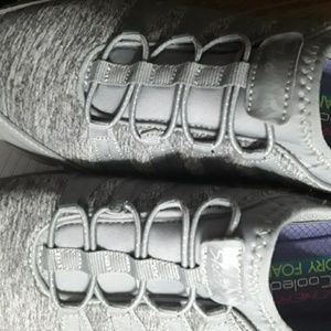 Sketchers Sneakers grey in color .